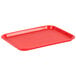 A red plastic Choice fast food tray on a counter.