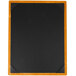 A black rectangular wood menu board with wooden corners on a wood surface.