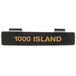 A black rectangular Tablecraft dispenser tag with orange text reading "Thousand Island"
