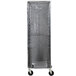 A black breathable mesh Curtron bun pan rack cover on a storage cart with wheels.