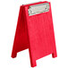A red wooden Menu Solutions sandwich menu board with a silver clip.