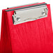 A red clipboard with a silver metal clip.