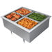 A stainless steel Hatco drop-in hot food well with three trays of food.