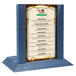A blue wood Menu Solutions table tent with a 4" x 6" insert slot holding a menu.