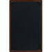 A brown wooden menu board with picture corners.