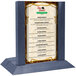 A wooden Menu Solutions table tent with a denim insert slot holding a menu on a table.
