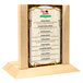 A Menu Solutions natural wood menu holder with a 4" x 6" insert slot on a table.