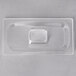 A clear plastic container with a square shaped lid.