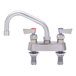A Fisher stainless steel deck-mounted faucet with 2 lever handles and a swing spout.