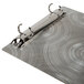 A Menu Solutions Alumitique aluminum menu board with swirl finish and rings on it.