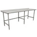 A long stainless steel Advance Tabco work table with a backsplash and open base.