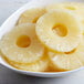 A bowl of Regal pineapple rings in natural juice.