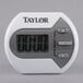 A white Taylor digital kitchen timer with grey accents.