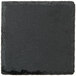 An Acopa black square stone with a rough edge.