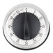 A close up of a Taylor stainless steel mechanical kitchen timer with black and white accents.