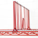 A Metro red wire shelf divider on a red wire shelf.