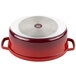 A red and silver oval dutch oven with a silver lid.