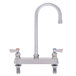 A silver Fisher deck-mounted faucet with lever handles and a swivel gooseneck nozzle.