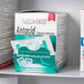 A box of Medi-First antacid tablets on a shelf.