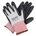 A pair of black and white Cordova Machinist cut resistant gloves with black foam nitrile palm coating.