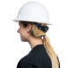 A woman wearing a white Cordova Duo full-brim hard hat with a ponytail.