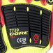 A pair of yellow and black Cordova OGRE-CR+ gloves with red sandy nitrile palms and TPR reinforcements.