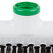 A white and green Unger floor squeegee brush with black tassels.