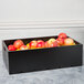 A black Tablecraft wood crate filled with red apples.