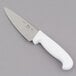 A Choice 6" chef knife with a white handle.