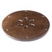 A circular mahogany wooden surface with metal holes.