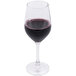 An Arcoroc wine glass filled with red wine.