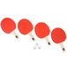 A close-up of four red Stiga ping pong paddles and a ball.
