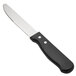 A Walco stainless steel steak knife with a black jumbo plastic handle.