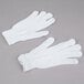 A pair of Cordova white polyester/cotton work gloves.