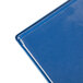 A Menu Solutions Hamilton Royal Blue menu board with a blue metal surface.