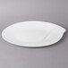 A white Villeroy & Boch oval platter with a curved edge.