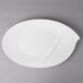 A white Villeroy & Boch oval platter with a curved edge.