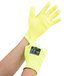 A pair of Cordova yellow cut resistant gloves with yellow polyurethane palms.