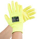 A pair of Cordova yellow gloves with a green and black label.
