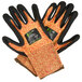 A pair of Cordova heavy duty work gloves with black and orange trim on the wrist and black nitrile palms.