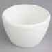 A Villeroy & Boch white porcelain covered sugar holder on a gray surface.