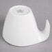 A white porcelain whale shaped tea cup.