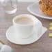 A white Villeroy & Boch porcelain cup of coffee on a saucer.