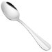 A close-up of a Walco stainless steel dessert spoon with a silver handle.