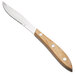 A Walco stainless steel steak knife with a wooden handle.