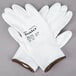 A pair of large white Cordova Halo gloves with white polyurethane-coated palms.
