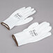 A pair of large white Cordova warehouse gloves with white polyurethane palm coating.