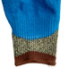 A Cordova blue and brown work glove with a blue latex palm coating.
