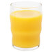 A Libbey Governor Clinton beverage glass filled with orange juice on a white background.