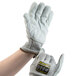 A pair of Cordova Monarch gray and white heavy duty work gloves with a split leather palm coating.